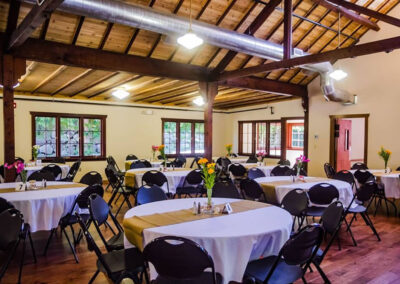 The Dining Hall’s main room with reception tables set for a party.